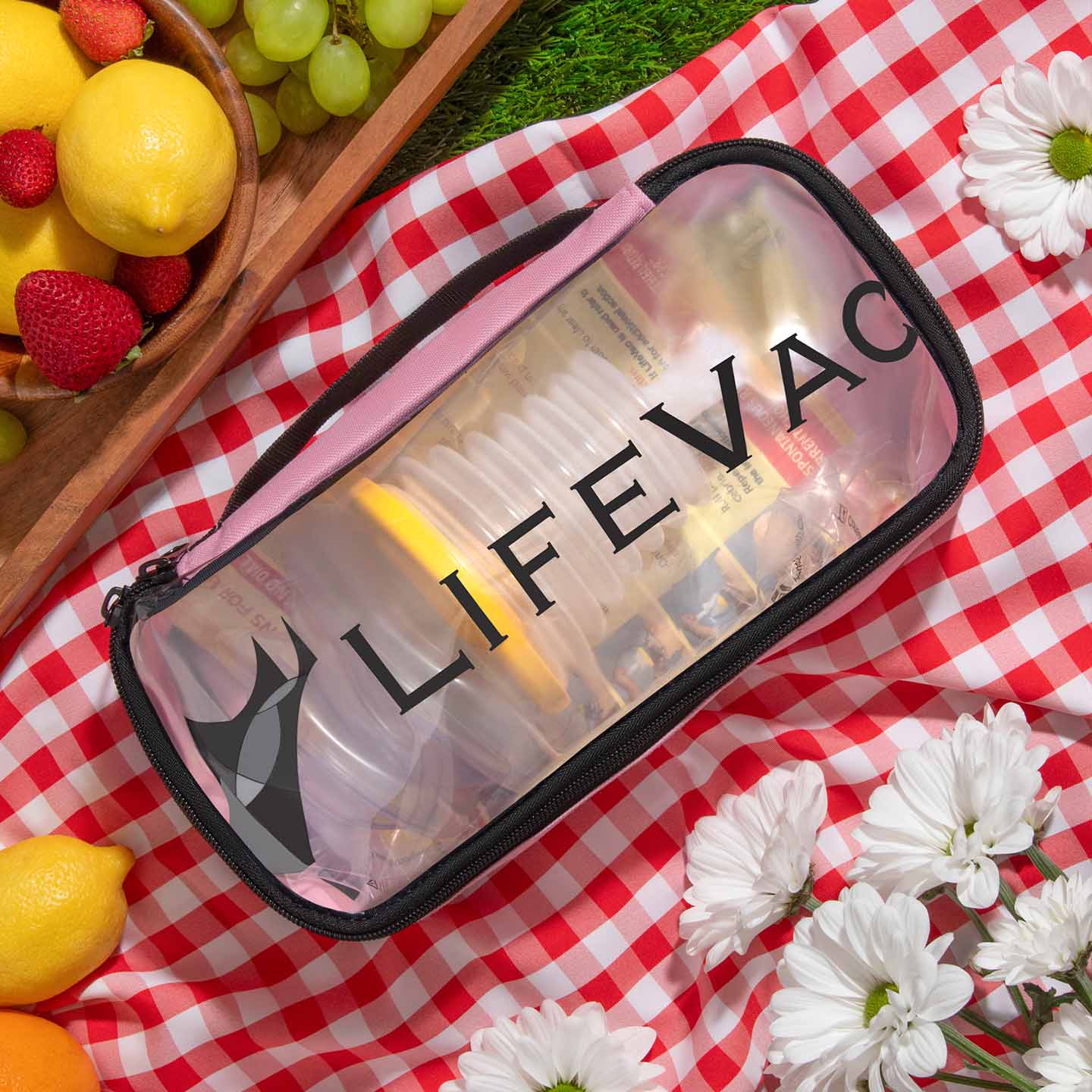 LifeVac Pink Travel Kit in a picnic setting